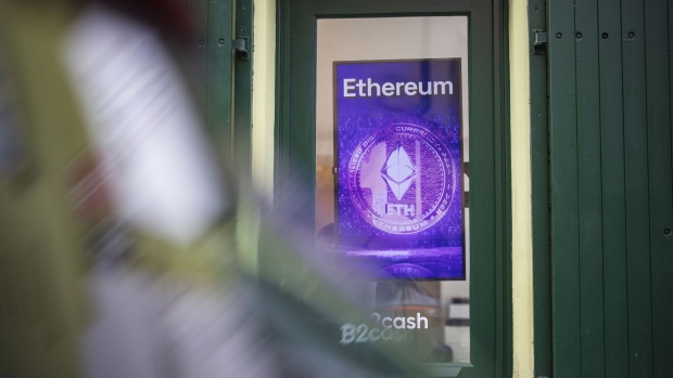 An Ethereum logo in the window of a cryptocurrency exchange office. Photographer: Milan Jaros/Bloomberg