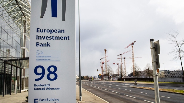 A logo outside the European Investment Bank (EIB) Eastbuilding near construction cranes in Luxembourg, on Monday, March 15, 2021. More than 60 financial firms have established operations in the Grand Duchy due to Brexit, according to Nicolas Mackel, the head of Luxembourg for Finance. Photographer: Olivier Matthys/Bloomberg