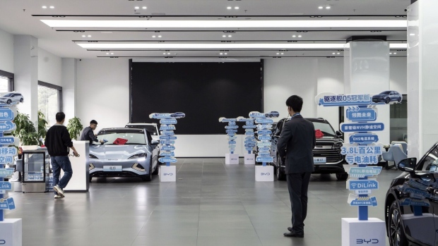 Employees at a BYD Co. showroom in Shenzhen, China. Photographer: Qilai Shen/Bloomberg