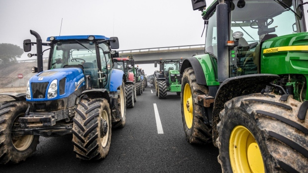 Farmers block the A2 Highway with their tractors during a protest in Fondarella, Spain, on Tuesday, Feb. 6, 2024. The demonstration is part of a broader wave of protests by farmers in France and across Europe over what they describe as unfair competition from abroad, plans to cut subsidies and planned EU regulations.