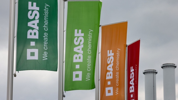 Flags at an entrance to the BASF SE chemical plant in Ludwigshafen, Germany, on Tuesday, April 25, 2023. BASF SE reported mixed preliminary first-quarter results, with higher-than-expected operating profit and revenue that missed analyst expectations after rising energy costs reduced the company’s output. Photographer: Alex Kraus/Bloomberg