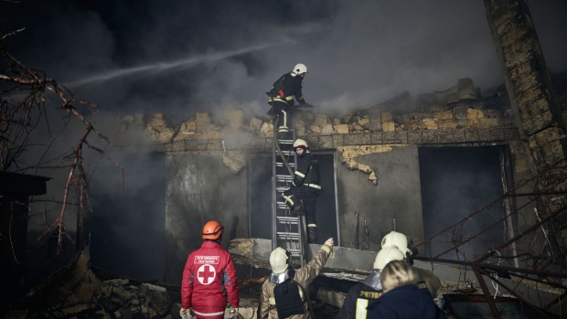 Emergency services work at the scene of a Russian drone attack in Odesa, Ukraine, on Feb. 23.