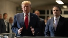 Former US President Donald Trump, left, speaks to members of the media at New York State Supreme Court in New York, US, on Thursday, Feb. 15, 2024. A judge in New York ruled Donald Trump's trial over alleged hush-money payments to a porn star will start as planned on March 25, making it the first of four criminal cases against the former president to go before a jury.