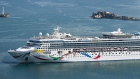 PORTLAND, ENGLAND - JULY 26: The first cruise ship, 'Norwegian Dawn' to arrive at Portland Port since the arrival of the Bibby Stockholm immigration barge, is seen docking, on July 26, 2023 in Portland, England. The Bibby Stockholm barge moored in Dorset's Portland Port is expected to house 500 asylum-seekers. The UN refugee agency condemned the passage of the government's Illegal Migration Bill as a "breach of international law" and warned it would expose refugees to "grave risks". (Photo by Finnbarr Webster/Getty Images)