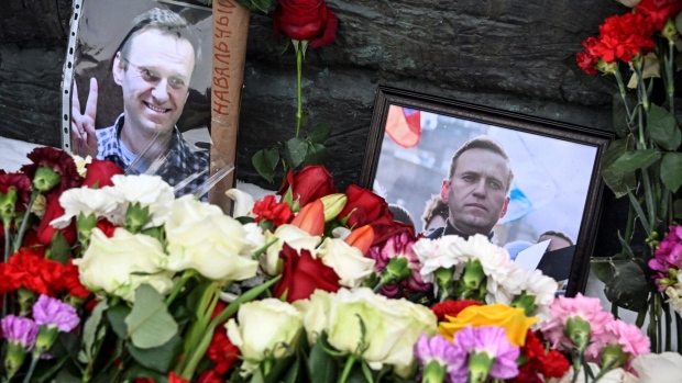 Photographs of Alexey Navalny at a memorial in Moscow on Feb. 17. Photographer: Alexander Nemenov/AFP/Getty Images
