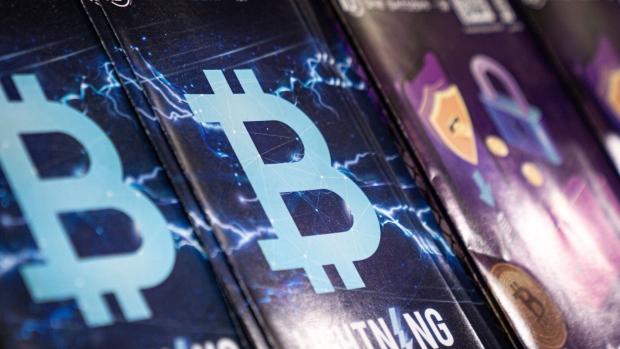 Leaflets featuring the Bitcoin logo at a One Satoshi over-the-counter (OTC) cryptocurrency store in Hong Kong, China, on Monday, Feb. 26, 2024. Hong Kong pivoted toward fostering a digital-asset hub in late 2022, part of an effort to appear cutting-edge amid doubts about the city's future given Beijing's growing control over the former British colony. Photographer: Lam Yik/Bloomberg
