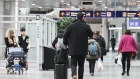 <p>Travelers at Pierre Elliott Trudeau International Airport in Montreal.</p>