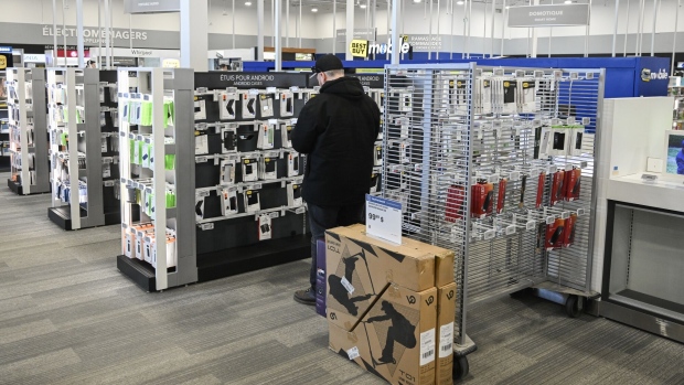A shopper browses Android device cases at a Best Buy store in Montreal, Quebec, Canada.