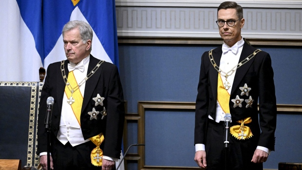 Alexander Stubb, right, takes over as president from Sauli Niinisto in Helsinki on March 1. Photographer: Heikki Saukkomaa/AFP/Getty Images