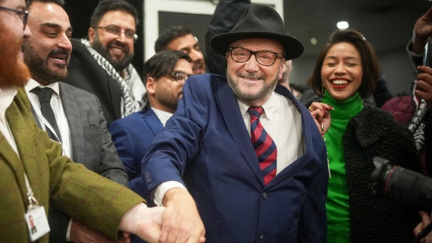 George Galloway celebrates with supporters after winning the Rochdale by-election on Feb. 29.