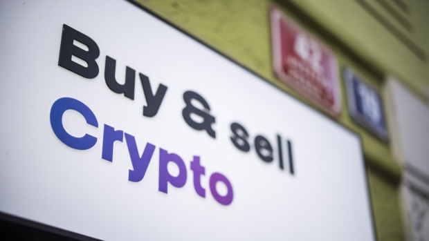 A sign reading 'Buy And Sell Crypto' outside a cryptocurrency exchange office in Prague, Czech Republic, on Friday, Jan. 5, 2024. Bitcoin has been on a tear ahead of an upcoming Jan. 10 deadline that could see the US Securities and Exchange Commission approve the first exchange-traded fund tied directly to the asset’s spot price. Photographer: Milan Jaros/Bloomberg