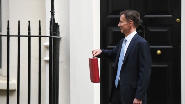 Jeremy Hunt, UK chancellor of the exchequer, departs 11 Downing Street to present his budget to parliament in London, UK, on Wednesday, March 6, 2024. Hunt plans to put personal tax cuts at the center of his annual budget on Wednesday as he navigates tight public finances to deliver on Conservative demands for a pre-election giveaway to boost the ailing governing party’s standing with voters. Photographer: Chris J. Ratcliffe/Bloomberg