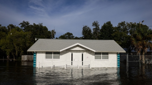 A house partially submerged in floodwaters after Hurricane Idalia made landfall in Cristal River, Florida, US, on Wednesday, Aug. 30, 2023. Hurricane Idalia knocked out power to hundreds of thousands of Florida customers, grounding more than 1,800 flights and unleashing floods along far from where it came ashore as a Category 3 storm earlier Wednesday. Photographer: Eva Marie Uzcategui/Bloomberg