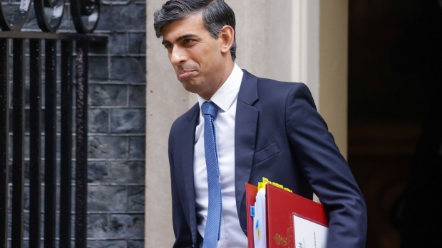 Rishi Sunak, UK prime minister, departs 10 Downing Street, ahead of the presentation of the Autumn Statement in parliament, in London, UK, on Wednesday, Nov. 22, 2023. UK Chancellor of the Exchequer Jeremy Hunt aims to boost business investment by £20 billion ($25 billion) a year by unleashing a package of measures on Wednesday including making permanent a 100% tax relief on investment spending by British businesses. Photographer: Jason Alden/Bloomberg