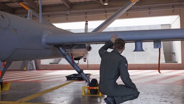 <p>An Israeli Air Force drone pilot inspects a Hermes 900 unmanned aerial vehicle at Palmachim Airbase in November. The drone is manufactured by Elbit Systems. </p>