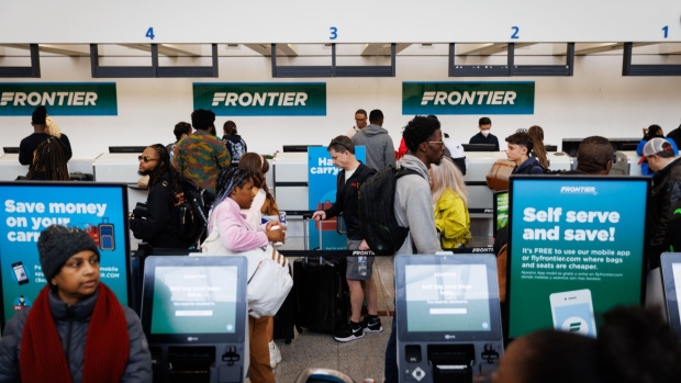 The announcement marks the latest in discount airlines’ unending quest to monetize every aspect of flights, from water to printed boarding passes. Photographer: Dustin Chambers/Bloomberg