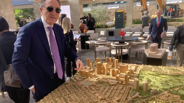 Jonathan Goldstein with a model of One Beverly Hills.