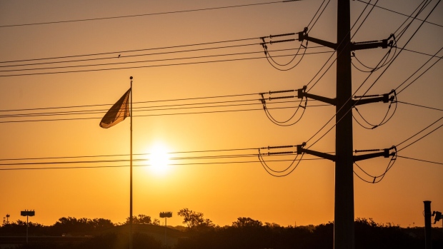 Power lines in Austin, Texas, US, on Friday, Sept. 8, 2023. Texas is in the midst of its worst power crisis since a deadly winter storm more than two years ago, with utilities urging customers to unplug electric vehicles and pool filters to conserve power. Photographer: Sergio Flores/Bloomberg