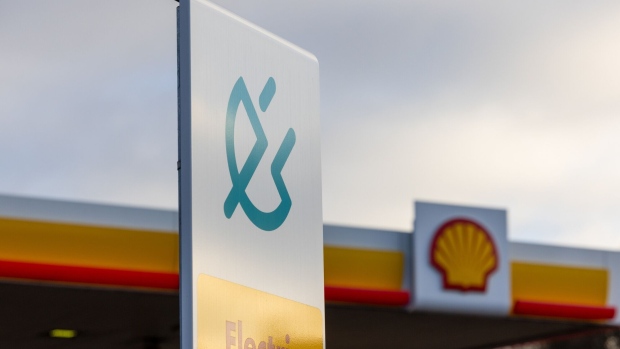 An electric charging sign at the entrance to a Shell Plc petrol station in Romford, UK, on Thursday, Feb. 2, 2023. Shell posted a fourth-quarter profit that was well ahead of expectations as its natural gas business thrived, lifting the oil major to a record performance in 2022 fueled by soaring energy prices.
