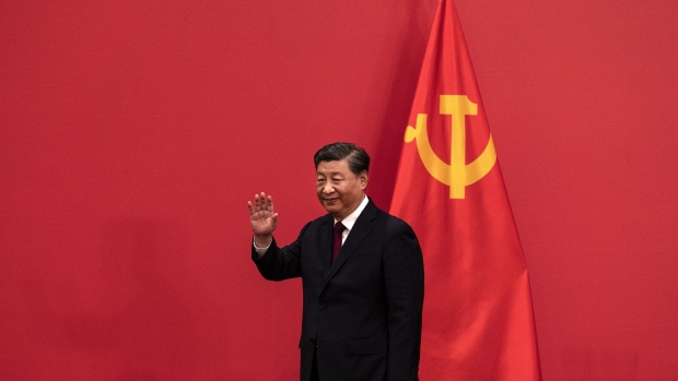 BEIJING, CHINA - OCTOBER 23: General Secretary and Chinese President Xi Jinping waves as he arrives for a press event with Members of the new Standing Committee of the Political Bureau of the Communist Party of China and Chinese and Foreign journalists at The Great Hall of People on October 23, 2022 in Beijing, China. (Photo by Kevin Frayer/Getty Images) Photographer: Kevin Frayer/Getty Images
