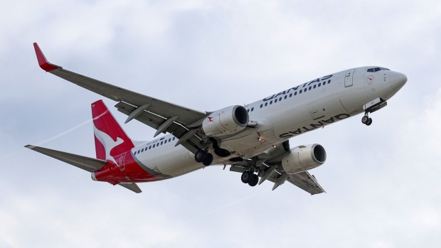 <p>A Qantas Airways jet approaches Sydney Airport.</p>