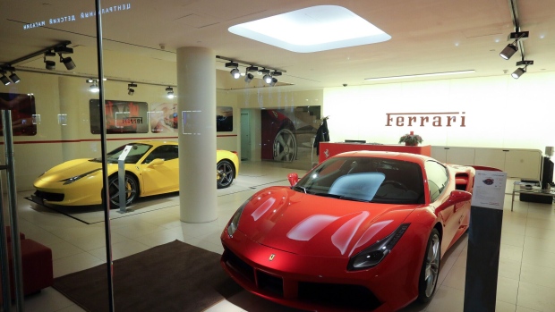 A Ferrari 458 Italia, left. Photographer: Andrey Rudakov/Bloomberg