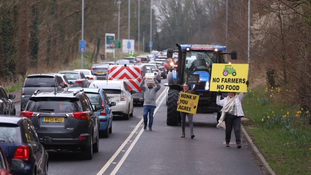 <p>Farmers hold placards as they protest in Preston, England on March 10.</p>