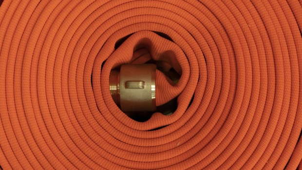 A rolled-up fire hose. Photographer: Bloomberg Creative Photos/Bloomberg Creative Collection