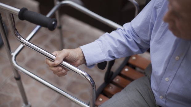 An elderly resident sits inside a nursing home. Photographer: Bartek Sadowski/Bloomberg