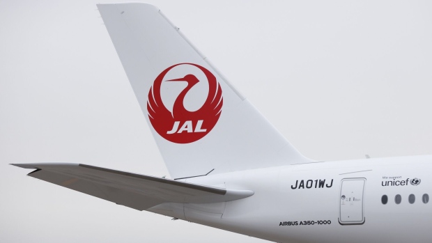 Japan Airlines Co. (JAL) takes delivery of an Airbus SE A350-1000 aircraft at Haneda Airport in Tokyo, Japan, on Friday, Dec. 15, 2023. JAL is betting that double beds in new first class suites will win passengers and prestige, seeking to challenge rival elite airlines in the global race to be the most luxurious carrier in the sky. Photographer: Kiyoshi Ota/Bloomberg