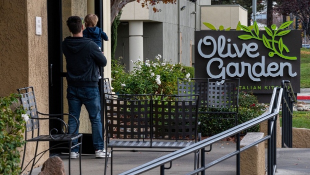 <p>Customers enter an Olive Garden restaurant in Pittsburg, California.</p>