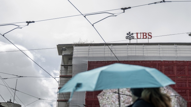 A logo above the UBS Group AG bank branch on the Paradeplatz in Zurich, Switzerland, on Saturday, March 16, 2024. The Swiss National Bank will announce interest rates on March 21. Photographer: Pascal Mora/Bloomberg
