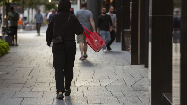 A shopper carries a bag in Toronto.