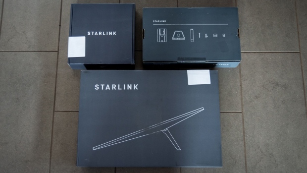 The Starlink kit comes with a dish, dish mount, and a Wi-Fi router base unit.  Photographer: Cate Dingley/Bloomberg