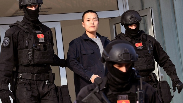 Police escort Do Kwon from court in Podgorica, Montenegro, on March 23. Photographer: Savo Prelevic/AFP/Getty Images