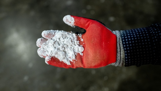 A worker holds lithium at SQM’s plant in Antofagasta.