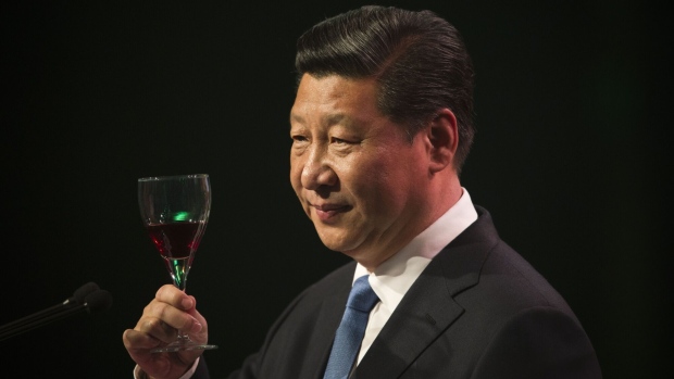 AUCKLAND, NEW ZEALAND - NOVEMBER 21: Chinese President Xi Jinping raises his glass for a toast during his talk before lunch at SkyCity Grand Hotel on November 21, 2014 in Auckland, New Zealand. President Xi Jinping is on a two day trip to New Zealand to have talks with New Zealand Government and business leaders in Auckland and Wellington. (Photo by Greg Bowker - Pool/Getty Images)