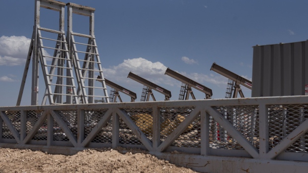 A row of pumpjacks is seen as U.S. Vice President Mike Pence, not pictured, tours a Diamondback Energy Inc. oil rig in Midland, Texas, U.S., on Wednesday, April 17, 2019. Pence gave remarks to employees regarding the impacts of the Administration's United States-Mexico-Canada Agreement.