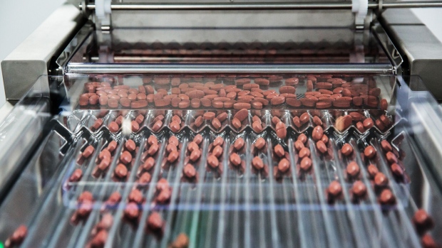 <p>Metformin pills move through a sorting machine at a pharmaceutical plant in India.</p>