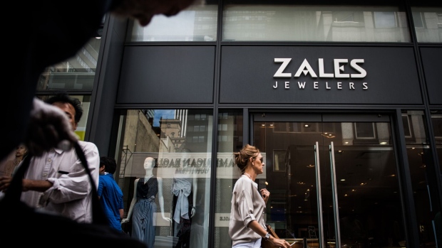 Pedestrians pass in front of a Zales Jewelers store in New York.