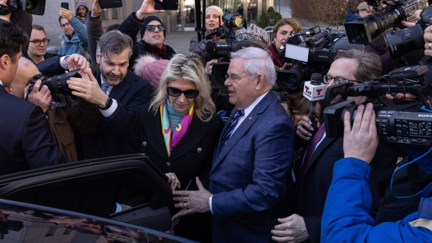 <p>Robert Menendez and his wife, depart federal court in New York, March 11.</p>