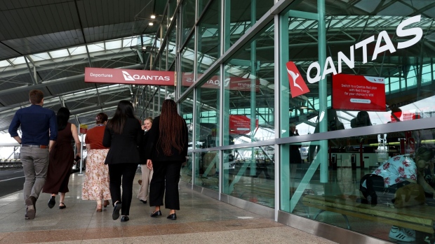 <p>Qantas Airways signage at Sydney Airport at Sydney Airport in Sydney, Australia.</p>
