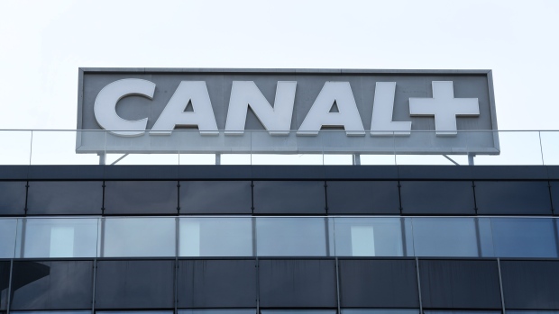 A sign on the roof of the Canal+ France SA offices in Paris, France, on Thursday, March 14, 2024. Media conglomerate Vivendi is preparing to consult with investors and employees on its plan to split into four listed units as it seeks better value from its assets, which span from pay-TV to ads, music and publishing. Photographer: Benjamin Girette/Bloomberg