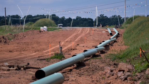 <p>Sections of pipe at an Energy Transfer Partners LP construction site for a natural gas liquids pipeline.</p>