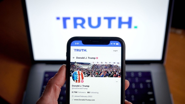 The Truth Social website on a smartphone arranged in New York, US, on Friday, March 22, 2024. Shareholders of Digital World Acquisition Corp., a publicly traded shell company, approved a deal to merge with the Trump's media business in a Friday vote. That means Trump Media & Technology Group, whose flagship product is social networking site Truth Social, will soon begin trading on the Nasdaq stock market, reported the AP. Photographer: Gabby Jones/Bloomberg