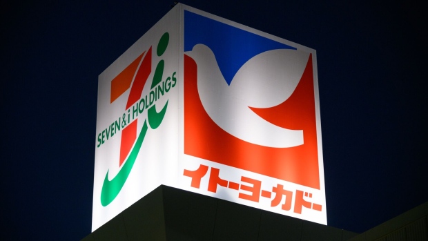 The Seven & I Holdings Co. logo displayed atop of an Ito-Yokado supermarket in Kawasaki, Kanagawa Prefecture, Japan, on Monday, Jan. 9, 2023. Seven & i Holdings is scheduled to release its earnings figures on Jan. 12. Photographer: Akio Kon/Bloomberg