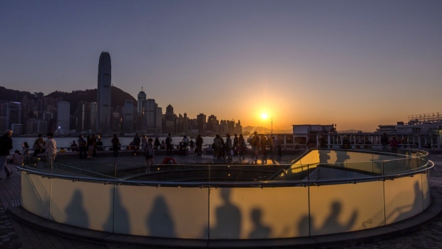 Hong Kong has traditionally been a popular spot for executives and staff of private equity and hedge funds, but it’s now facing competition from Dubai and Singapore. Photographer: Paul Yeung/Bloomberg