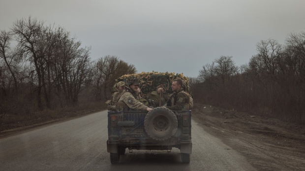 Ukrainian servicemen drive in a military vehicle near the town of Chasiv Yar, Donetsk region. Photographer: Roman Pilipey/AFP/Getty Images