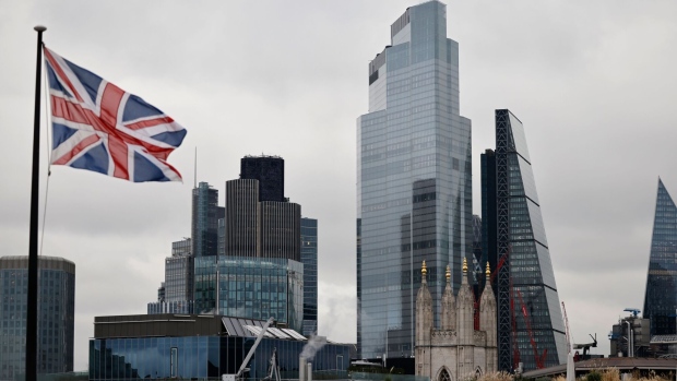 A Union Flag flutters in the City of London. Photographer: Tolga Akmen/AFP/Getty Images