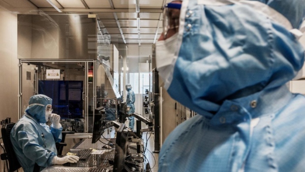 SOITEC employees works in the clean rooms of the factory, in Bernin, near Grenoble, France. Photographer: Jeff Pachoud/AFP/Getty Images